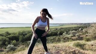 A girl is having fun with her boyfriend outdoors, testing their bodies
