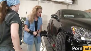The pretty and sexy girl is working in the auto shop