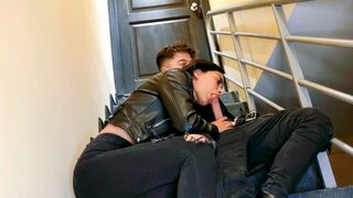 A hot chick is fucking with her boyfriend on the stairs of their apartment