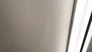 A hot chick is having fun with the sales assistant in the fitting room