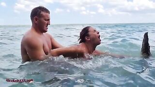 A couple enjoys amazing sex in the crystal clear waters of a famous lagoon