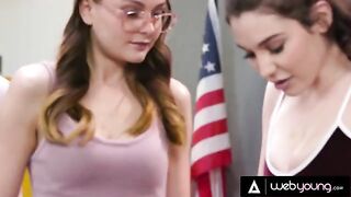 Two girls fuck each other with a rubber in a detention scene