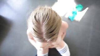 A nice woman is having fun with the guy in the gym