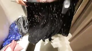 The hot girl is choosing a dress in the fitting room and gets fucked