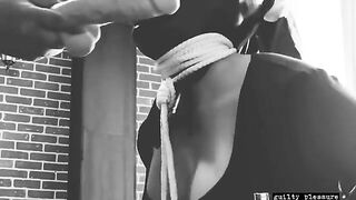 A BDSM sex tape features a bound slave getting fucked in the mouth and pussy with a dildo