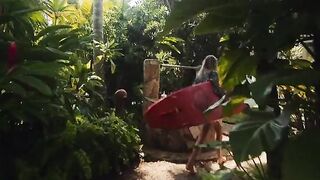 A couple enjoys romantic sex on the beach during their getaway