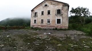 A girl is walking around horrible buildings with her sexy babe