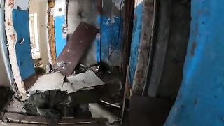 A girl is walking around horrible buildings with her sexy babe