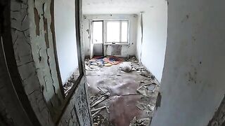 A girl is walking around horrible buildings with her sexy babe