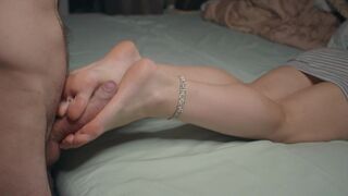 A petite beauty shows off her small feet and toes, captivating fans of foot fetish fantasies