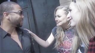 Two girls share a big cock in a hot threesome scene