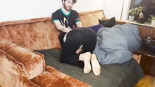A couple enjoy intimate moments under the blanket