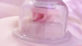 A girl masturbates with a toy and shows her nipples