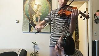 The guy tried to practice the violin, but the girl interrupted him with her hand