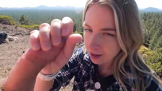 Blonde babe gives a blowjob on the mountain top, risking getting caught
