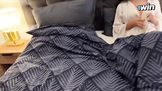 A hot stepmom shares a bed with her stepson on a rainy night
