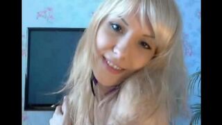 The blonde caresses her pussy with her fingers in a sensual solo act