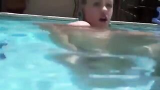 Girl was awarded a dildo in her ass right in the pool water