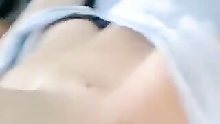 A half-naked girl is telling a lie and caressing her body