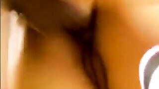 Asian woman fucked by two guys in her house, a steamy scene reminiscent of MEN.com’s intense group encounters