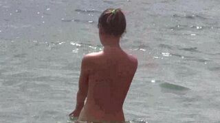 A group of people enjoy a day of fun and nakedness on the beach