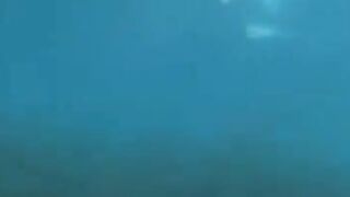 An aqualangist is fucking at the bottom of the sea