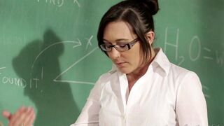 A student girl is being fucked by her lesbian teacher on the table