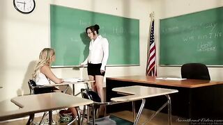 A student girl is being fucked by her lesbian teacher on the table