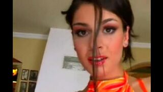 A nice woman masturbates in a leather chair, showcasing her solo skills