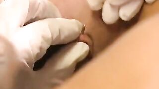 A hot girl with a pierced clitoris plays with sex toys