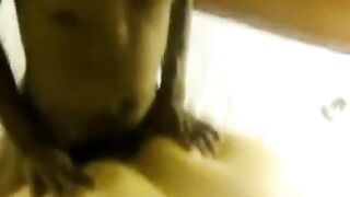 A fat woman lays down and takes two cocks in her big ass