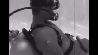 Diver made blowjob to the aqualung at the bottom of the pool
