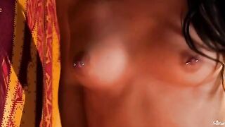 A chick with a nipple piercing plays with her fingers in her pussy