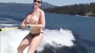 Topless girl water skiing is very attractive