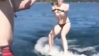 Topless girl water skiing is very attractive