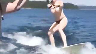 Topless girl water skiing is very attractive