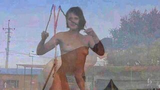 Nudist beach. A naked girl plays with soap bubbles