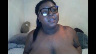 Black woman closes the camera with her big milking