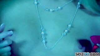 A blonde woman masturbates with a large dildo until she is satisfied