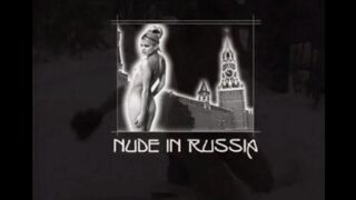 Nude girls are having fun with snowballs on the street