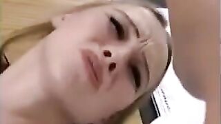 A sexy blondie has sex with two guys and gets her fisted