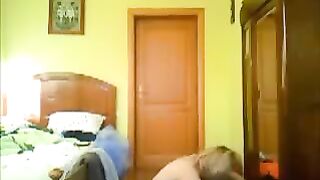 A man peeps at his home and sees a naked woman