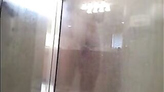 A man washes his body in the shower, but there’s a hidden camera