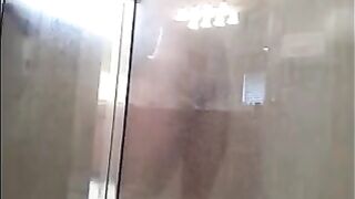 A man washes his body in the shower, but there’s a hidden camera
