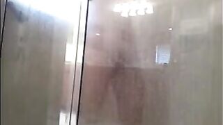 A man washes his body in the shower, but there’s a hidden camera