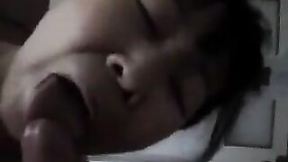 An appetizing Chinese woman practices her skills in giving a blowjob