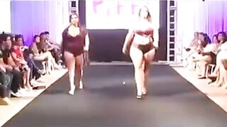 Chubby girls in swimsuits are running on the boardwalk and playing with the camera