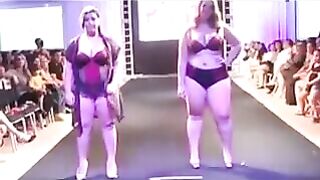 Chubby girls in swimsuits are running on the boardwalk and playing with the camera