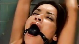 Girl was fucked by a bald man using a sex machine in a rough session