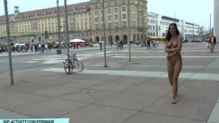 A hot chick is walking naked in the city, and many guys would love to join her